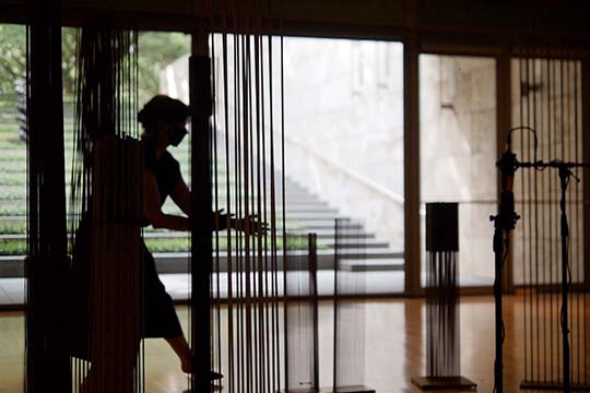 artist olivia block playing harry bertoia's sonambient sculptures