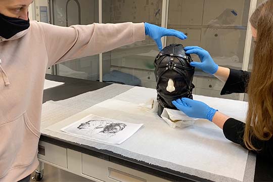 nasher conservation team begins adjustment of nancy grossman head sculpture